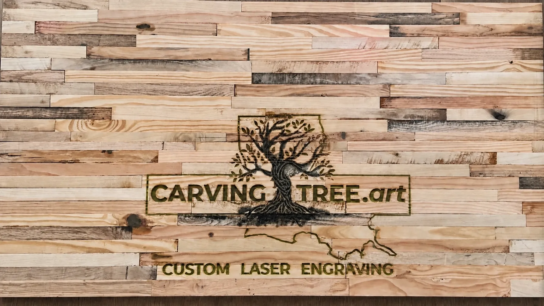 CarvingTree.art logo and Louisiana outline custom laser engraving on a reclaimed rustic wood desktop with epoxy edges